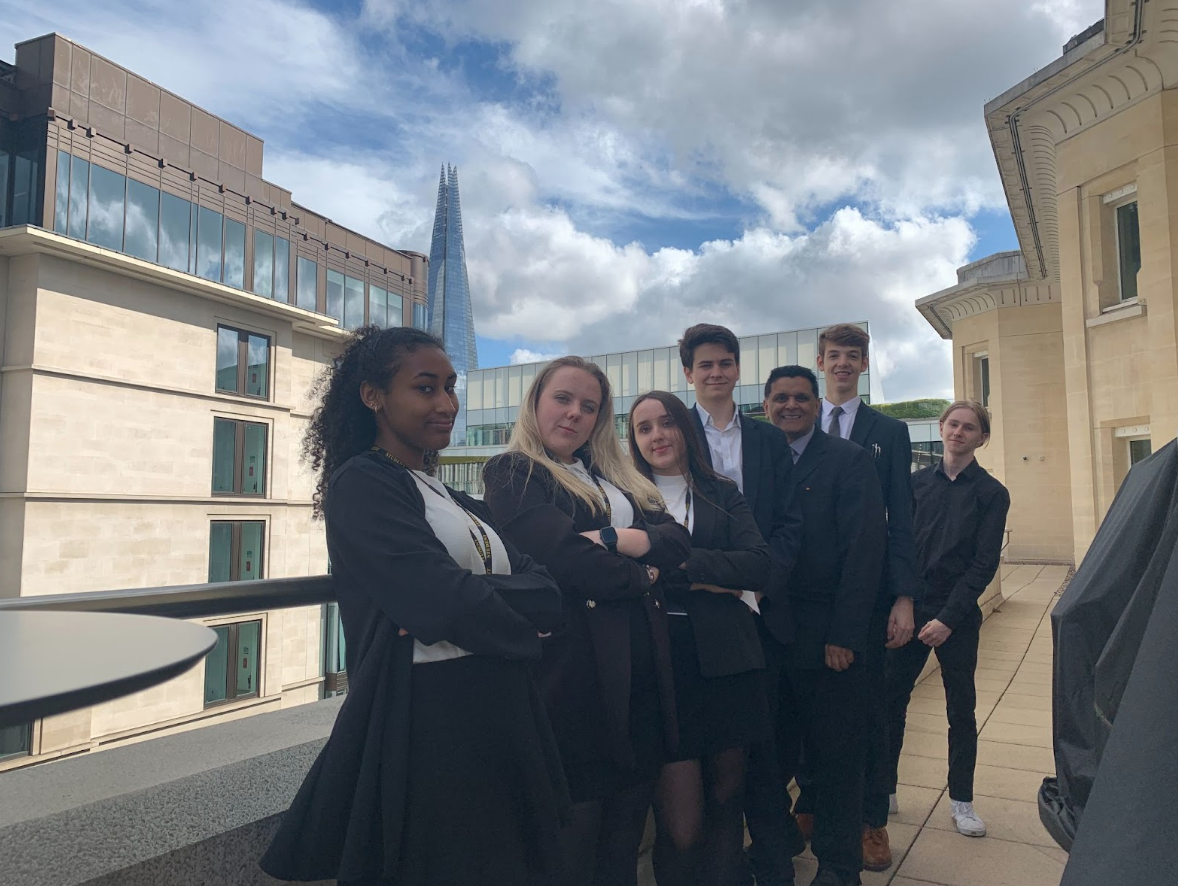 Photo of the Young Enterprise Team posing together on a balcony in Central London at the Young Enterprise of the Year Finals.