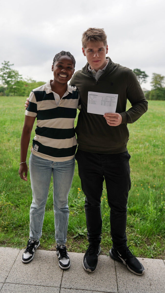 Conor holding their results with Ms Francis