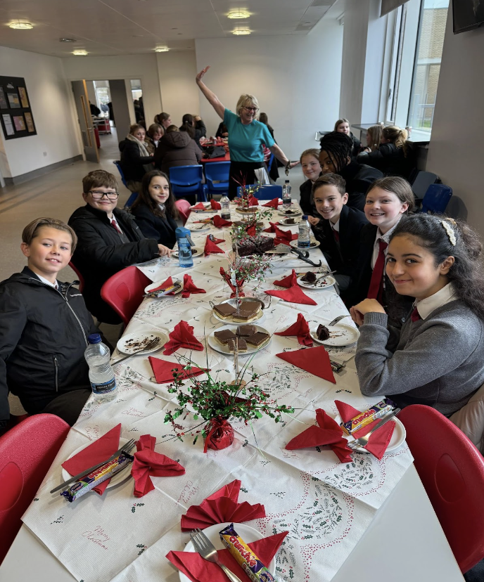 Students sat at a decorated table