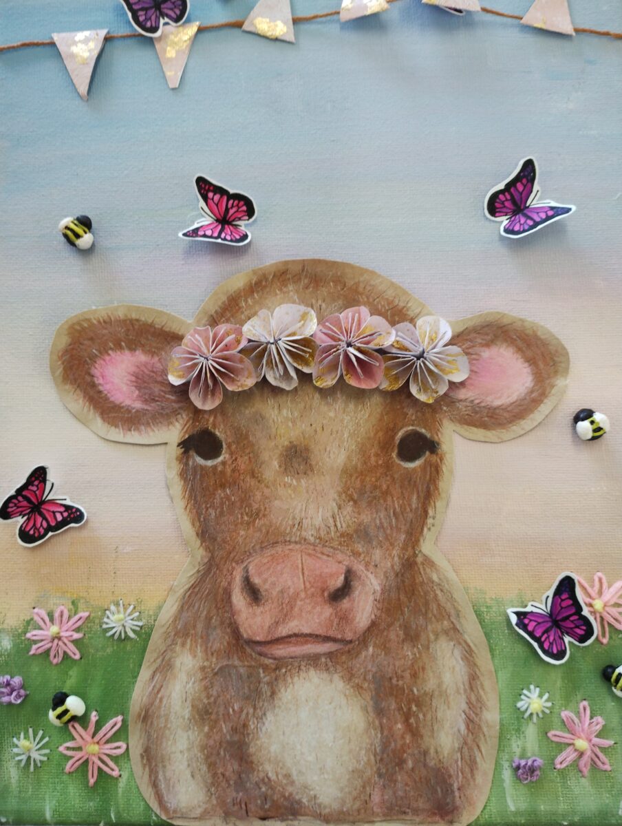 A student's artwork with a cow and butterflies